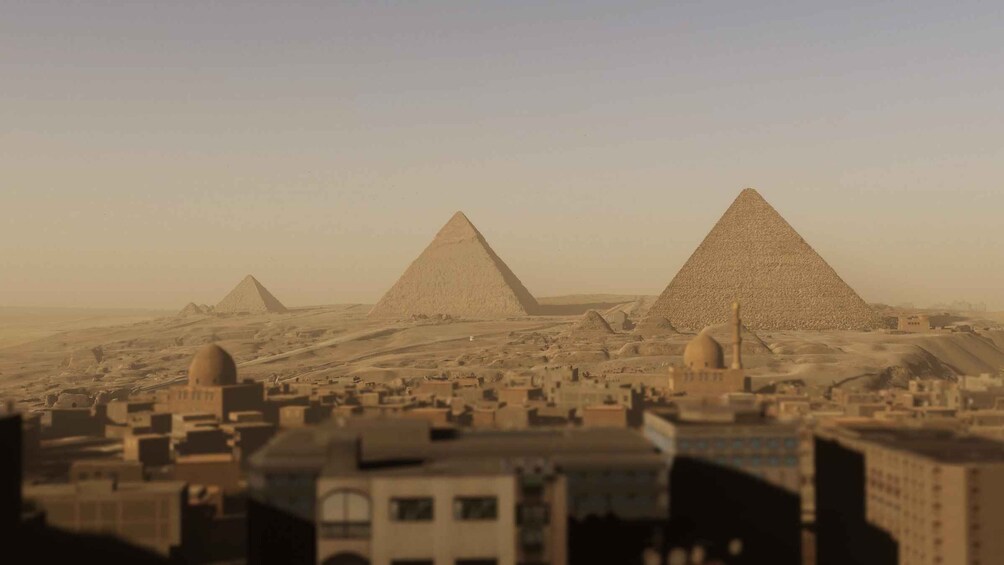 The Giza pyramids in Egypt with a cityscape in the foreground. 1
