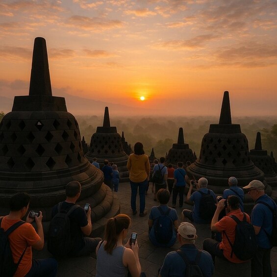 A group of people observing a sunset over ancient temple structures. 2