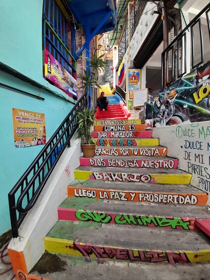 Colorful steps with graffiti and signs, leading to a bar named 'Bar Mirador'. 4