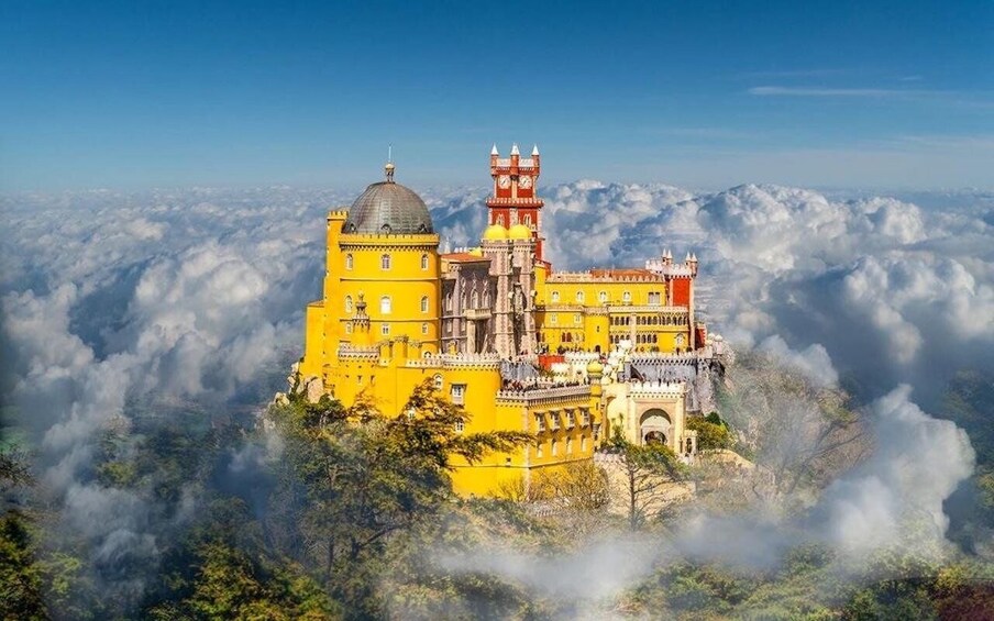 Pena Palace in Sintra, Portugal, surrounded by clouds. 4