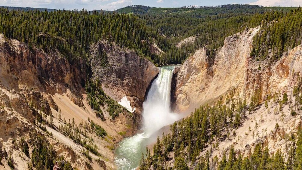 A canyon with a waterfall and a river. 5
