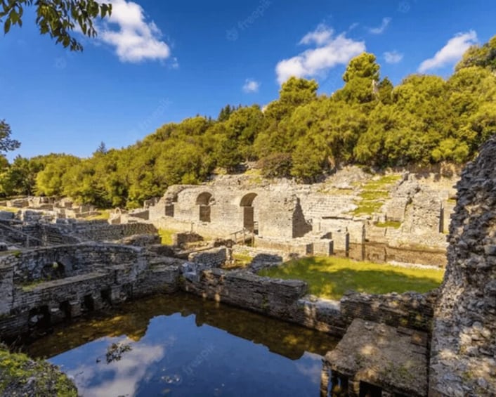 Ancient ruins with stone walls and a reflecting pool. 3