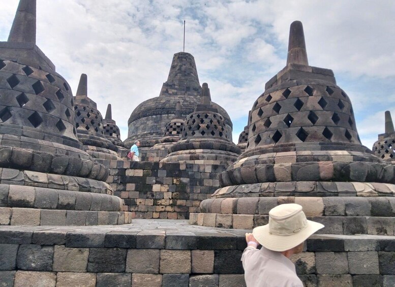 A temple complex with multiple stone structures, including large, dome-shaped buildings with intricate patterns. 5