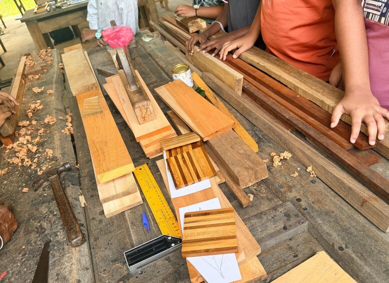 A workshop with various wooden planks and tools. 2