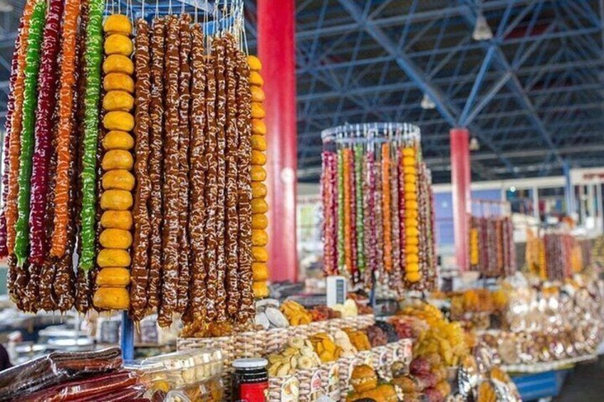 A market with various food items, including dried fruits and snacks. 5