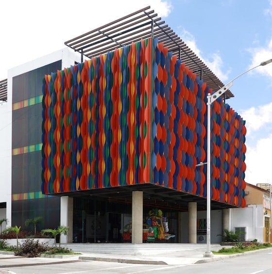A modern building with a colorful, wavy facade. 3