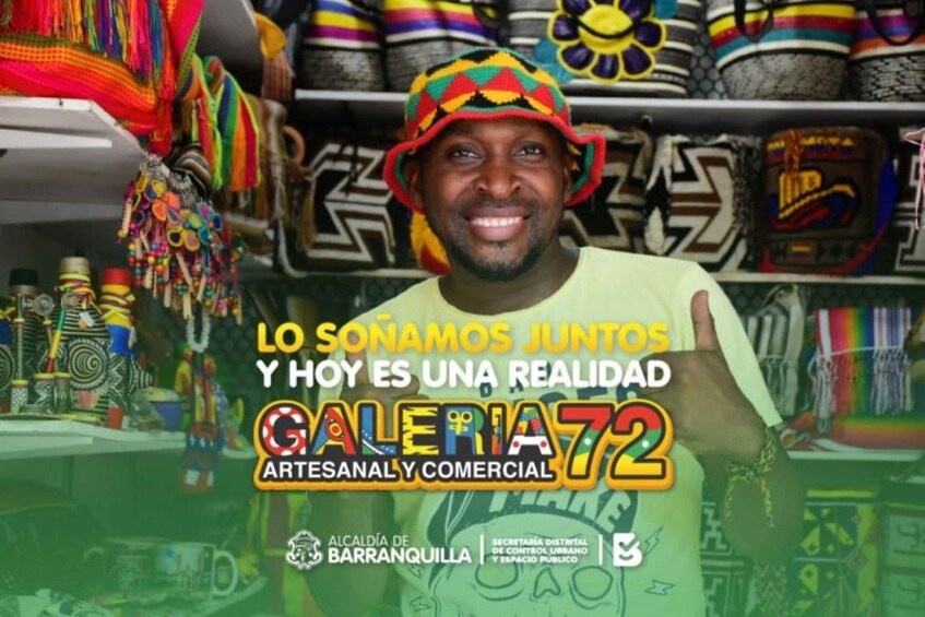 A person in a colorful hat in front of a display of textiles and crafts. Text on the image mentions 'Lo Sonamos Juntos Y Hoy Es Una Realidad Galeria 72 Artesanal y Comercial'. 2