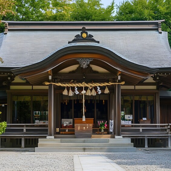 A traditional Japanese building with a curved roof and a decorative entrance. 5