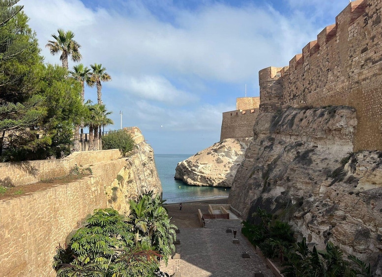 A coastal fortification with a staircase leading to a viewing platform, overlooking the sea. 1