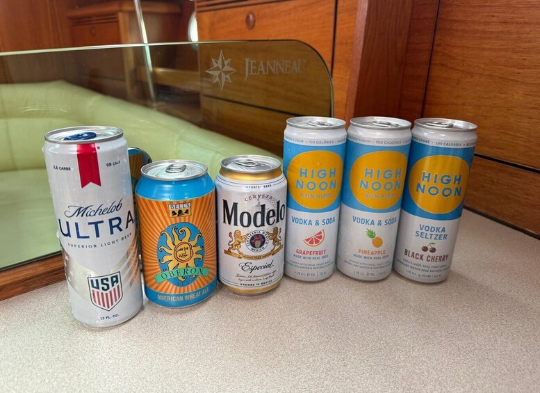 A collection of beverage cans on a countertop. 3