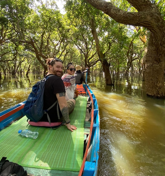 People on a boat in a mangrove forest. 5