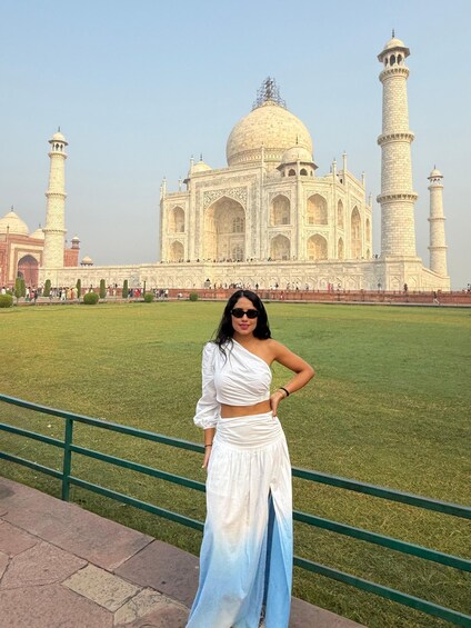 A person standing in front of the Taj Mahal. 5