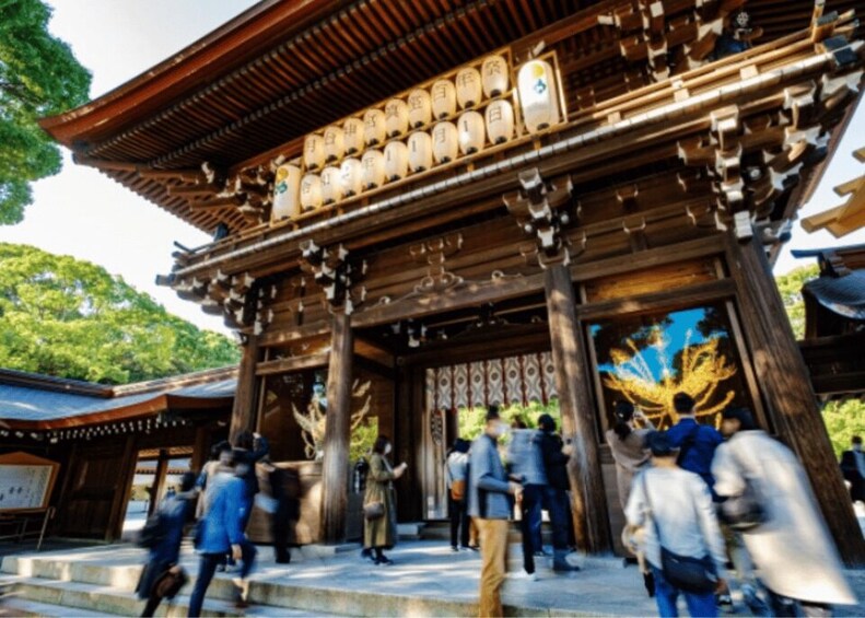 A traditional Japanese temple with wooden architecture and a large golden statue. 2