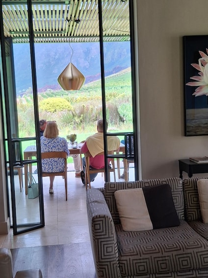 A dining area with a view of a lush landscape. 2