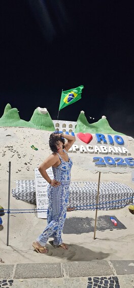 A person posing with a Brazilian flag, a sign reading 'RIO PACABANA 2026', and a beach setting. 4