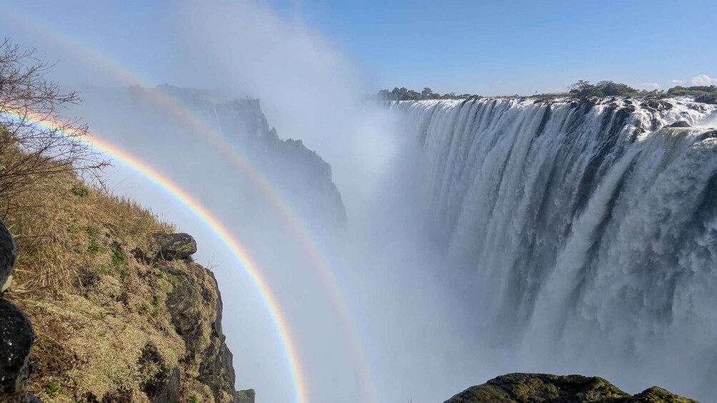 A waterfall with a rainbow. 4
