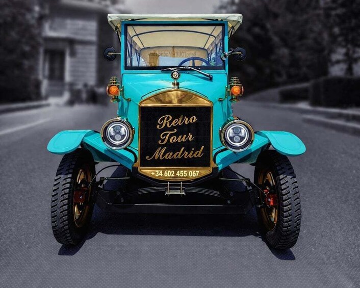 A turquoise vintage car with 'Retro Tour Madrid' on the front. 3