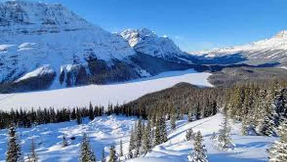 A snowy mountain landscape with a clear sky. 3