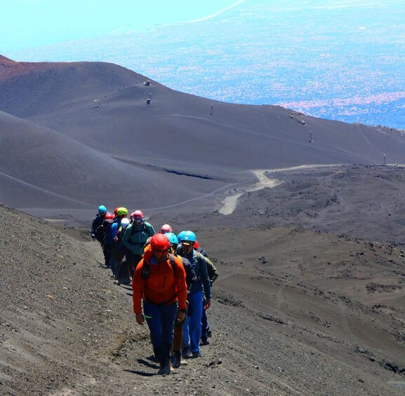 A group of hikers ascending a rocky mountain path. 1