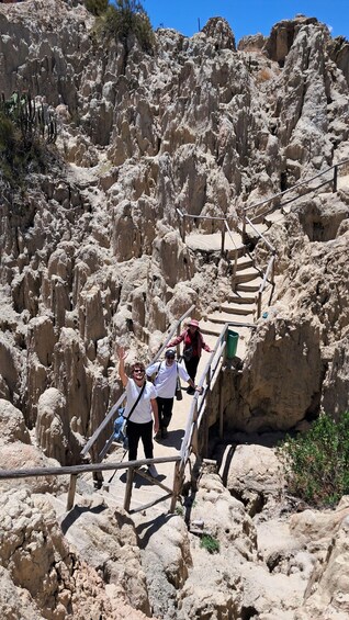 A rocky terrain with a wooden staircase leading up. 3