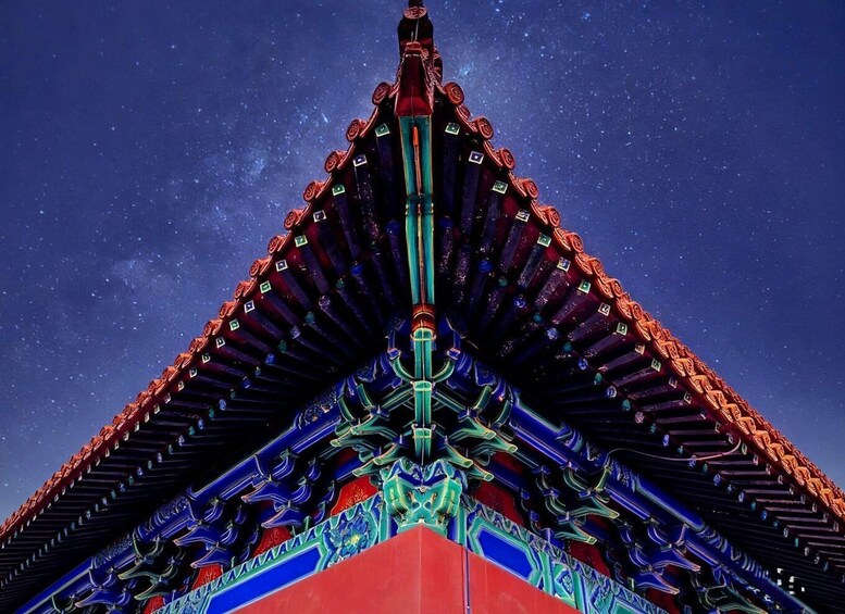 A traditional roof with intricate designs and a starry night sky. 5