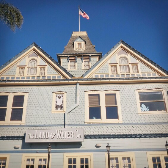 A building with a sign reading "The Land & Water Co." in Carlsbad, California. 4