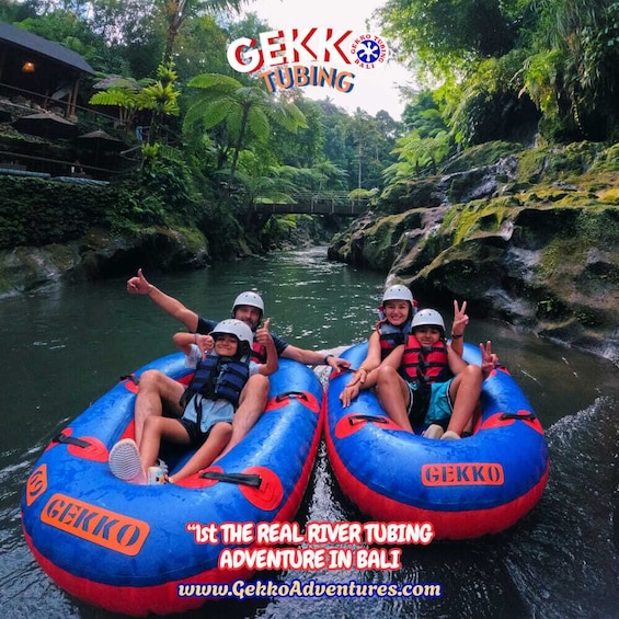 People rafting on a river surrounded by lush greenery. 3