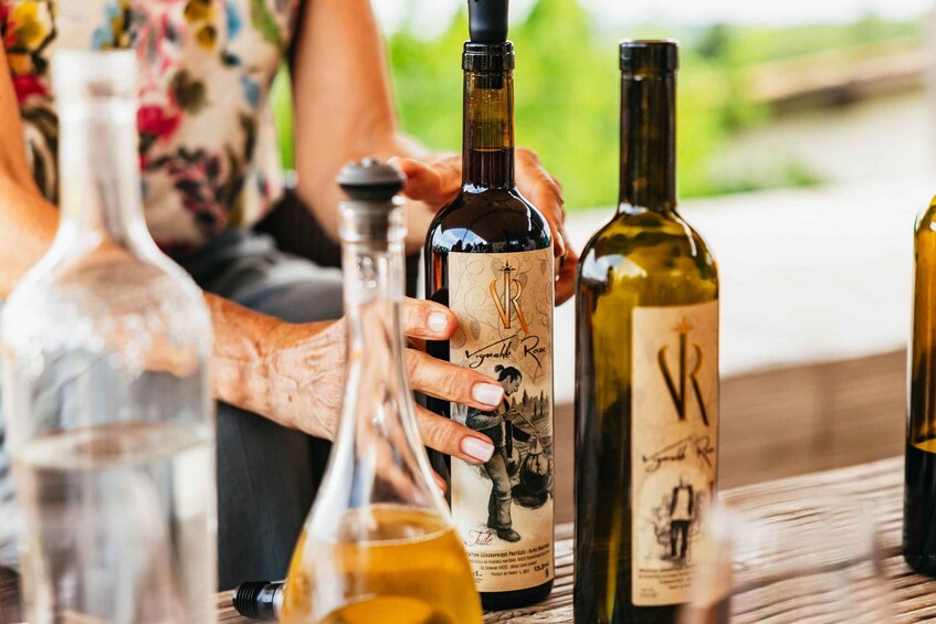 A variety of wine bottles on a table. 3
