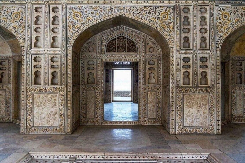 An ornate archway with intricate floral and geometric patterns. 4