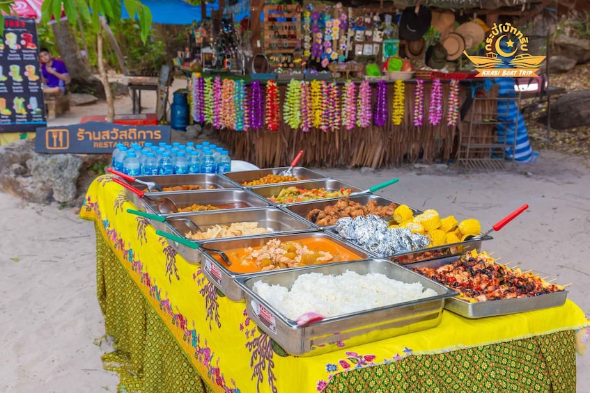 A buffet with various dishes and a sign for a restaurant in the background. 4