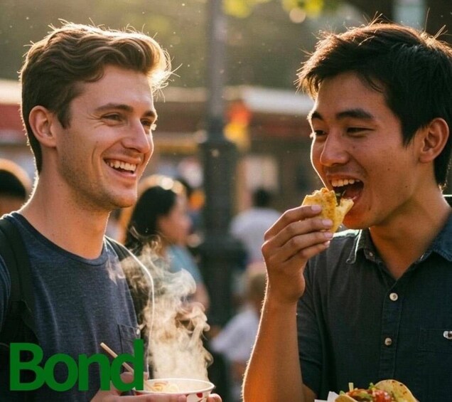 Two people eating food outdoors. 1