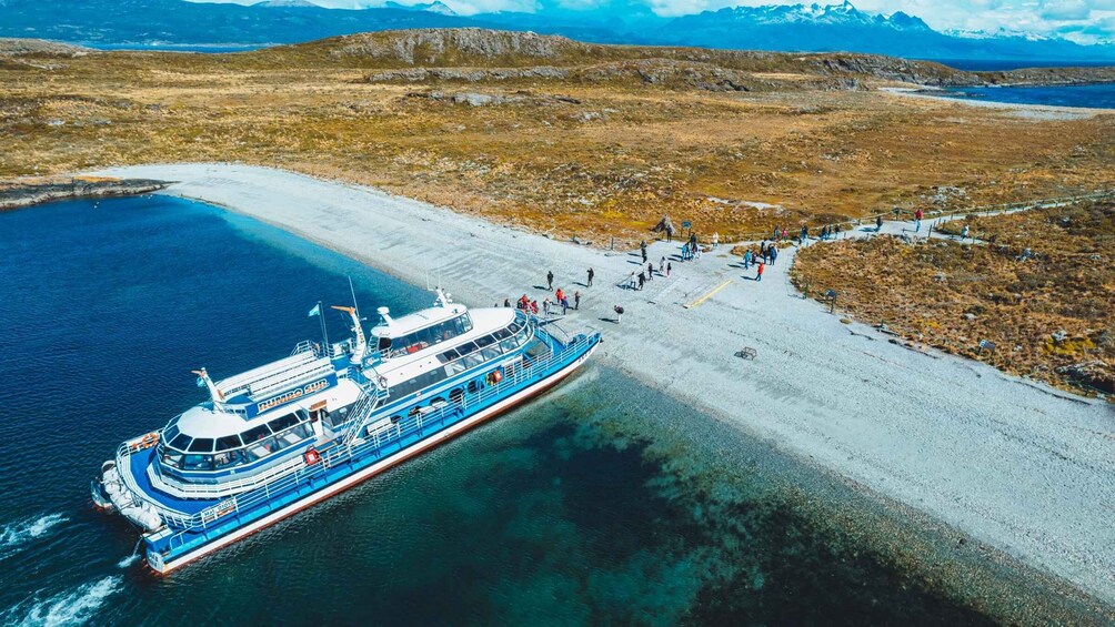 A ferry docked at a coastal area with a clear view of the surrounding landscape. 5