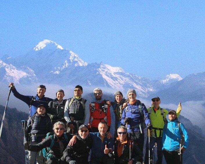 A group of people with skis and backpacks on a mountain. 1