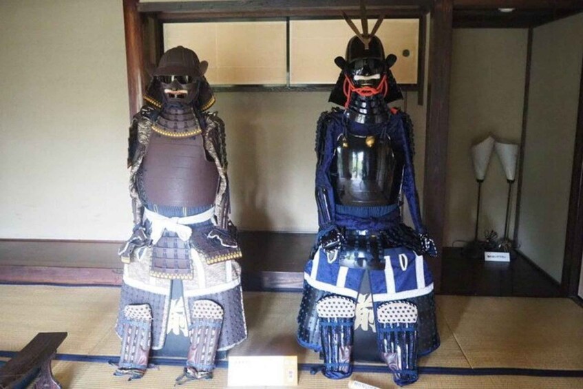 Two samurai armor displays in a traditional Japanese room. 4