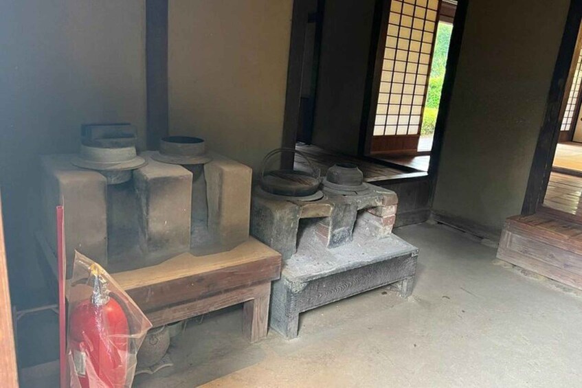 A traditional Japanese room with tatami flooring, a low wooden bench, and a shoji screen. 3