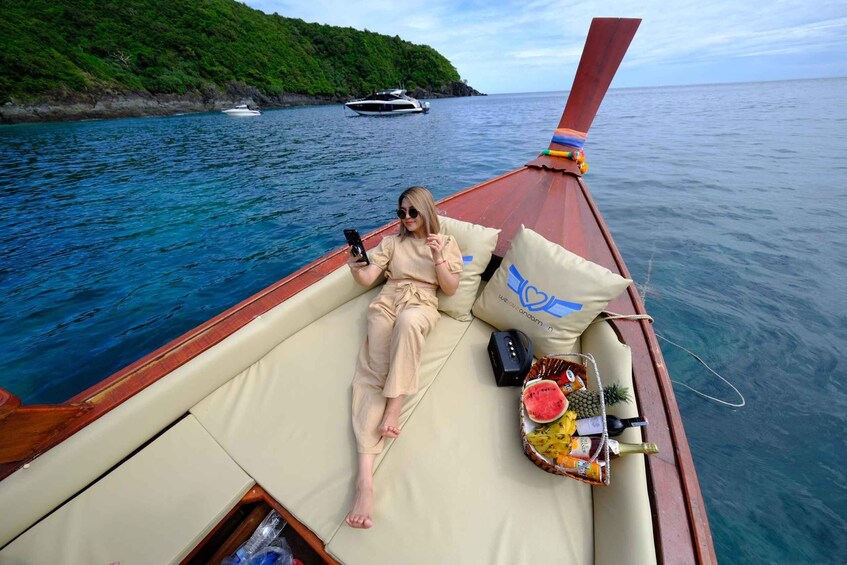 A person lying on a boat with a drink tray and a bottle. 5