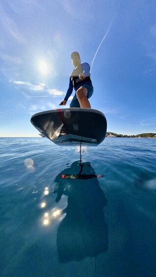 A person wakeboarding on a clear day. 3