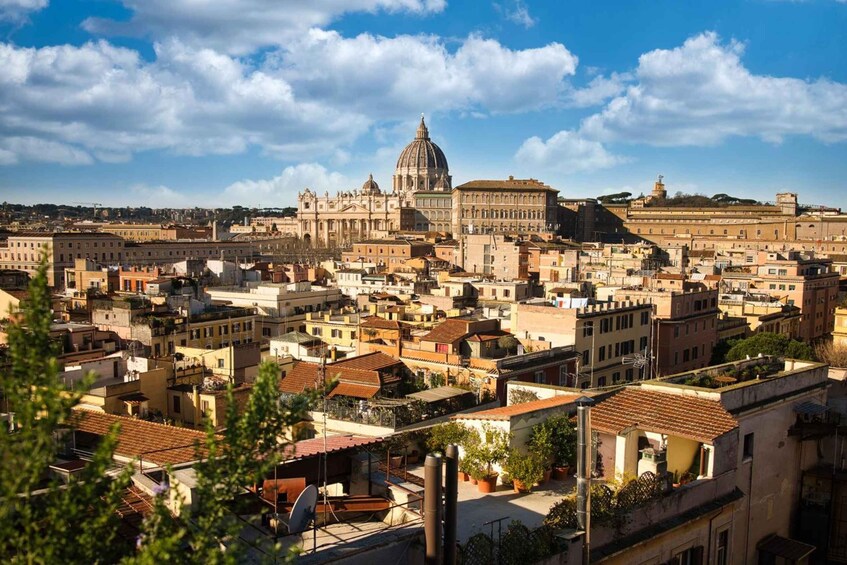 A cityscape with a prominent dome structure, likely a cathedral, surrounded by densely packed buildings. 5