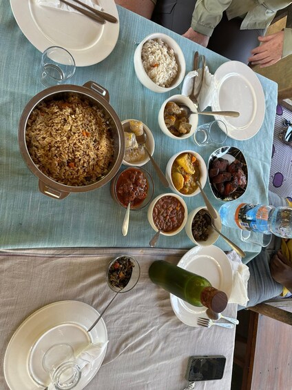 A table with various dishes including rice, meat, and vegetables. 4