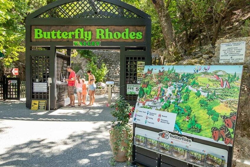 A sign for Butterfly Rhodes National Park with a map and entrance fee information. 5