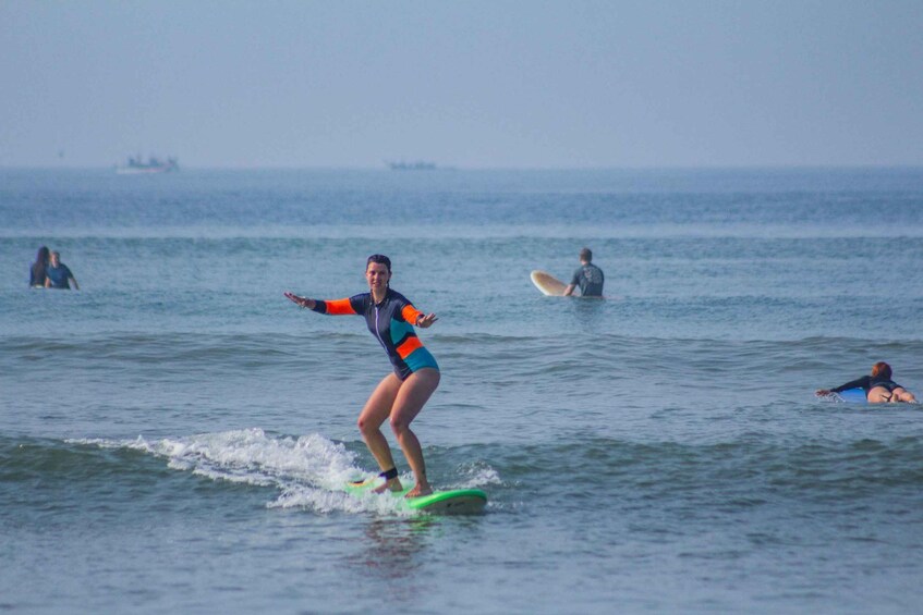 A person surfing on a wave in the ocean. 3