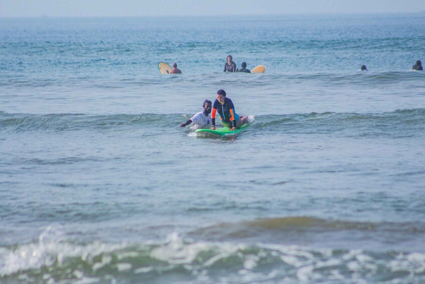 People surfing in the ocean. 4