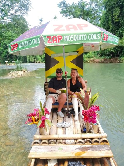 A couple on a bamboo boat with a mosquito coil advertisement. 3