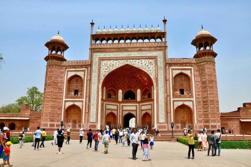 A large, ornate building with a central archway and two towers. 3