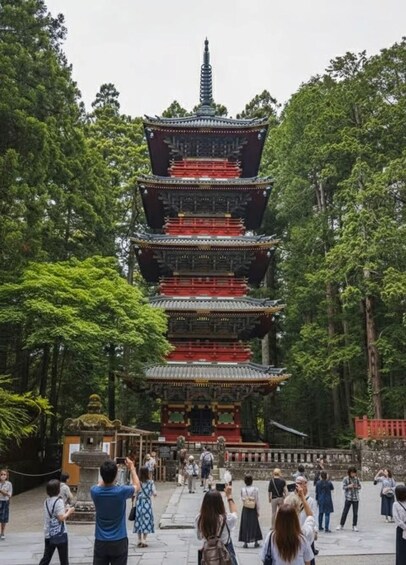 A multi-tiered pagoda surrounded by lush greenery. 3