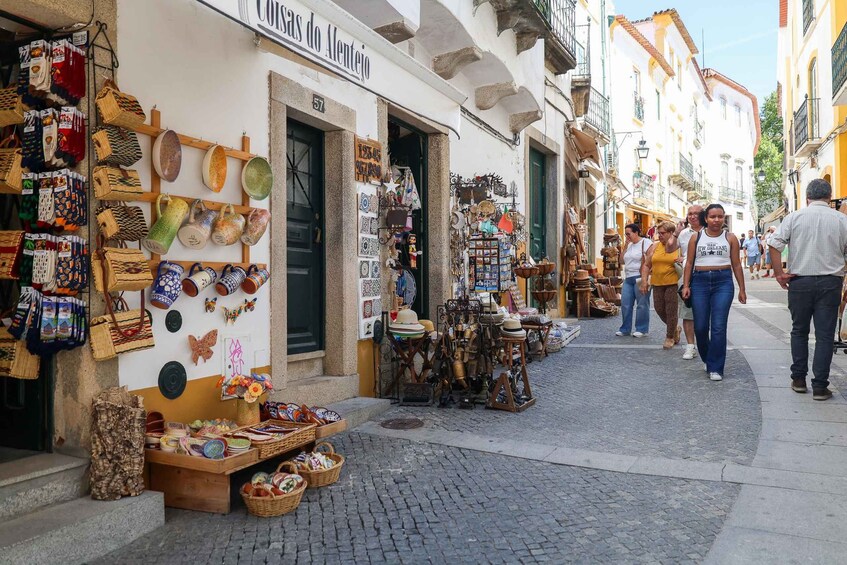 A street market with various stalls selling handicrafts and souvenirs. 4