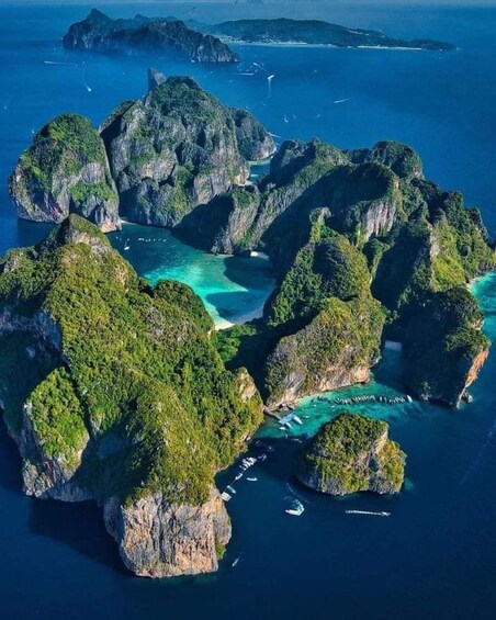 A cluster of lush green islands surrounded by turquoise waters. 2