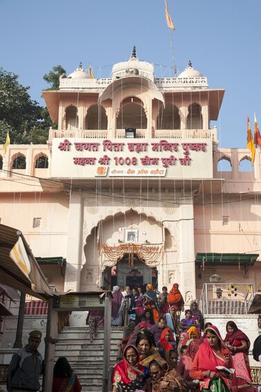A temple entrance with a crowd of people. 2