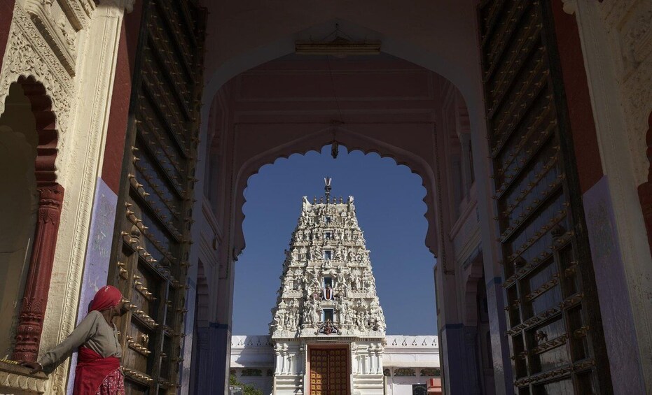 An ornate temple with intricate carvings and a large central tower. 4