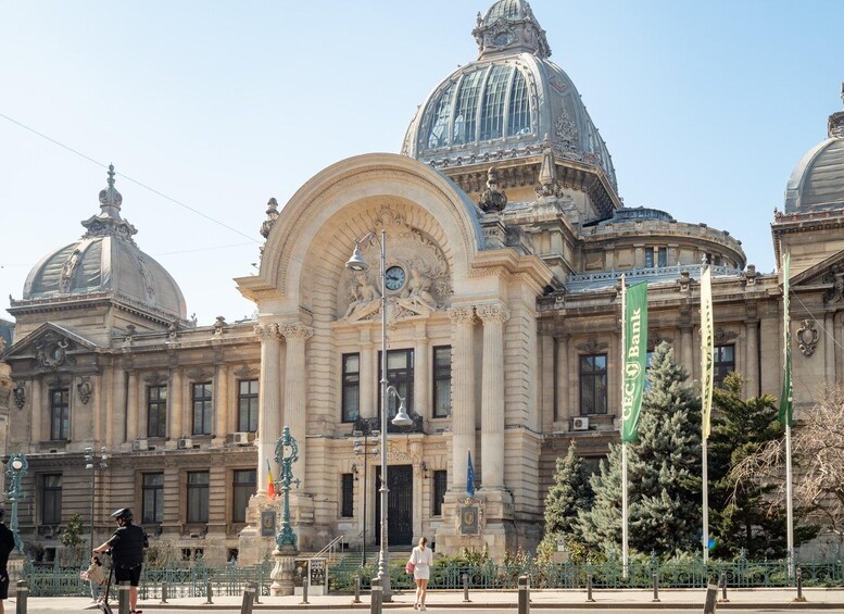 A grand building with ornate architecture, including domes and columns. 1
